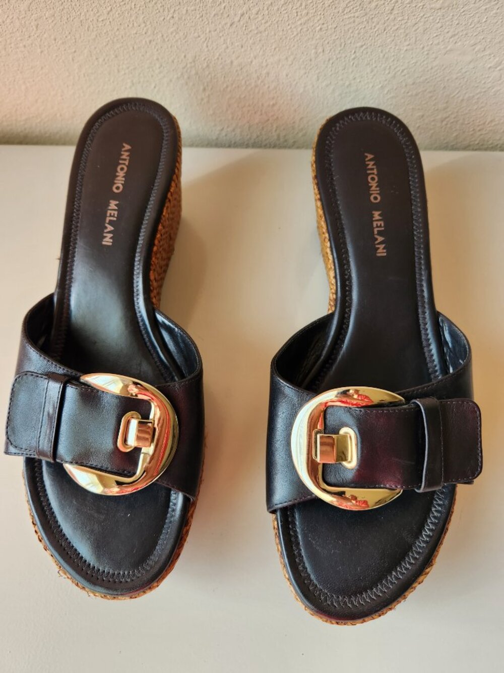 ANTONIO MELANI Black Leather Wedge Slide with Gold Buckle Accent